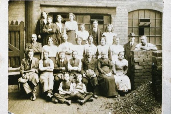 black and white image of coffin works' workforce